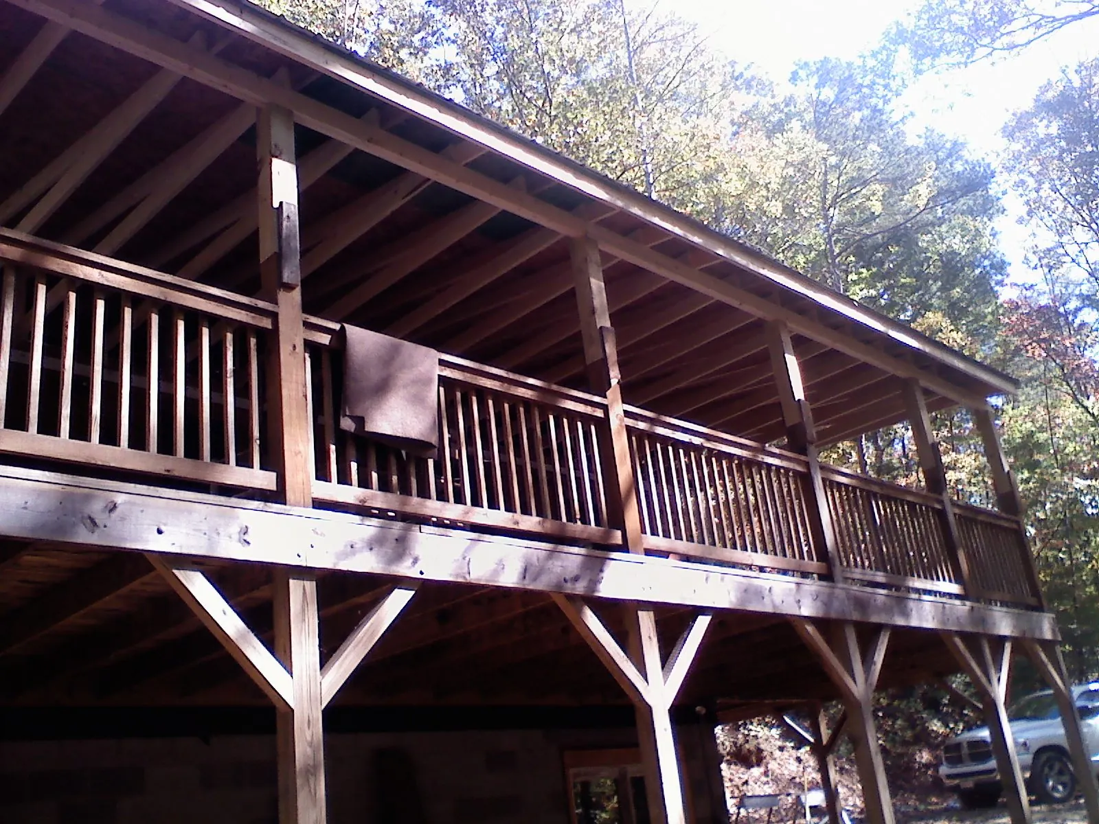 Timber framing under a new elevated porch and deck — Roof Leak Repair in Merced by Roofing Brothers