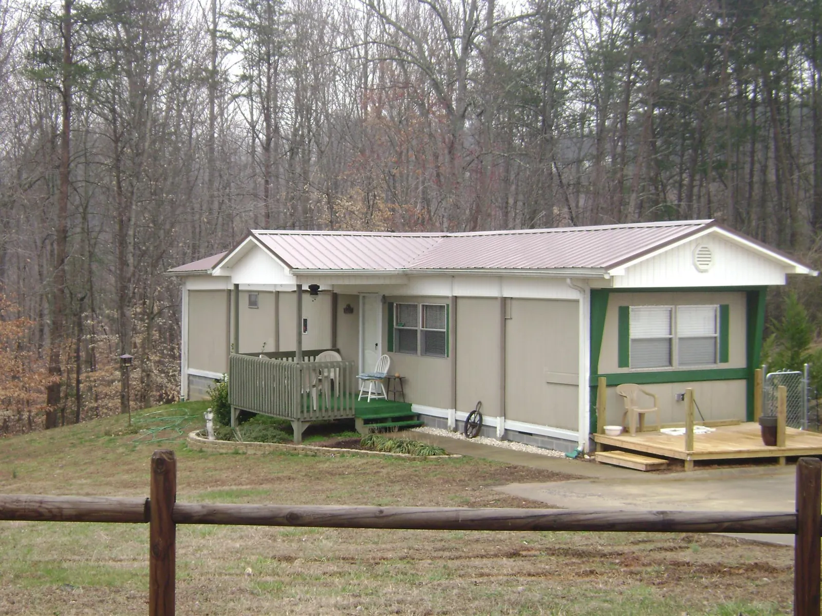 Mauve metal roof on a manufactured home with a new front deck in Merced